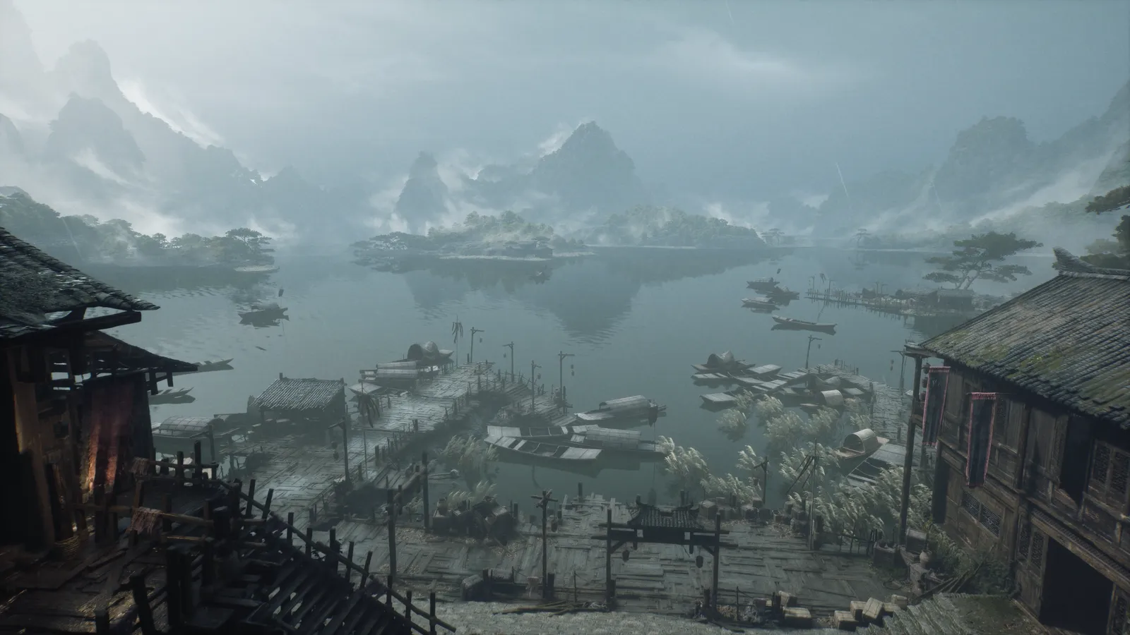 Aerial view of wooden docks, boats and pagoda gates on a misty lake ringed by karst mountains.