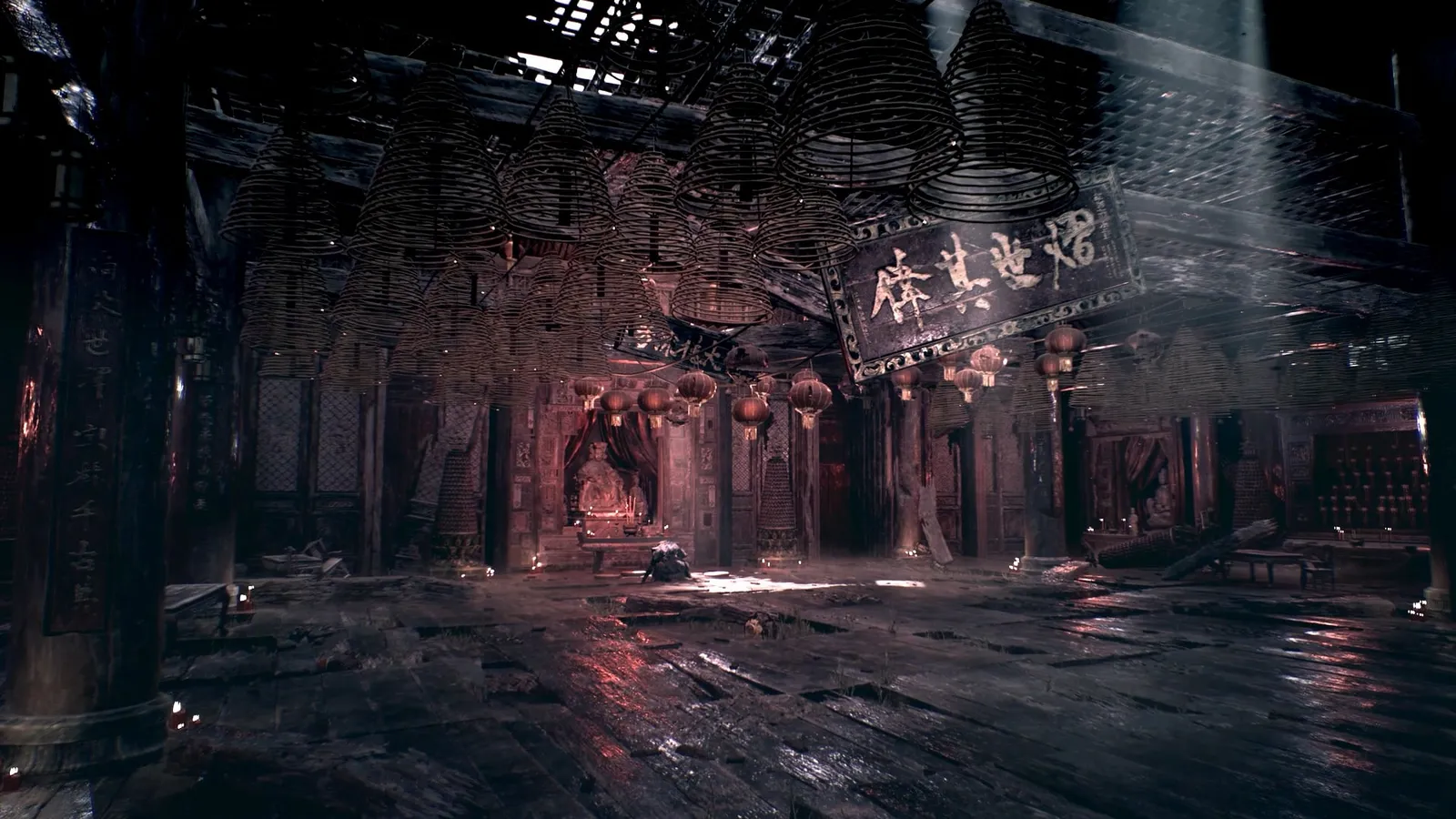 Temple hall with rows of hanging incense coils, red lanterns and a shaft of light falling on a wet wooden floor.