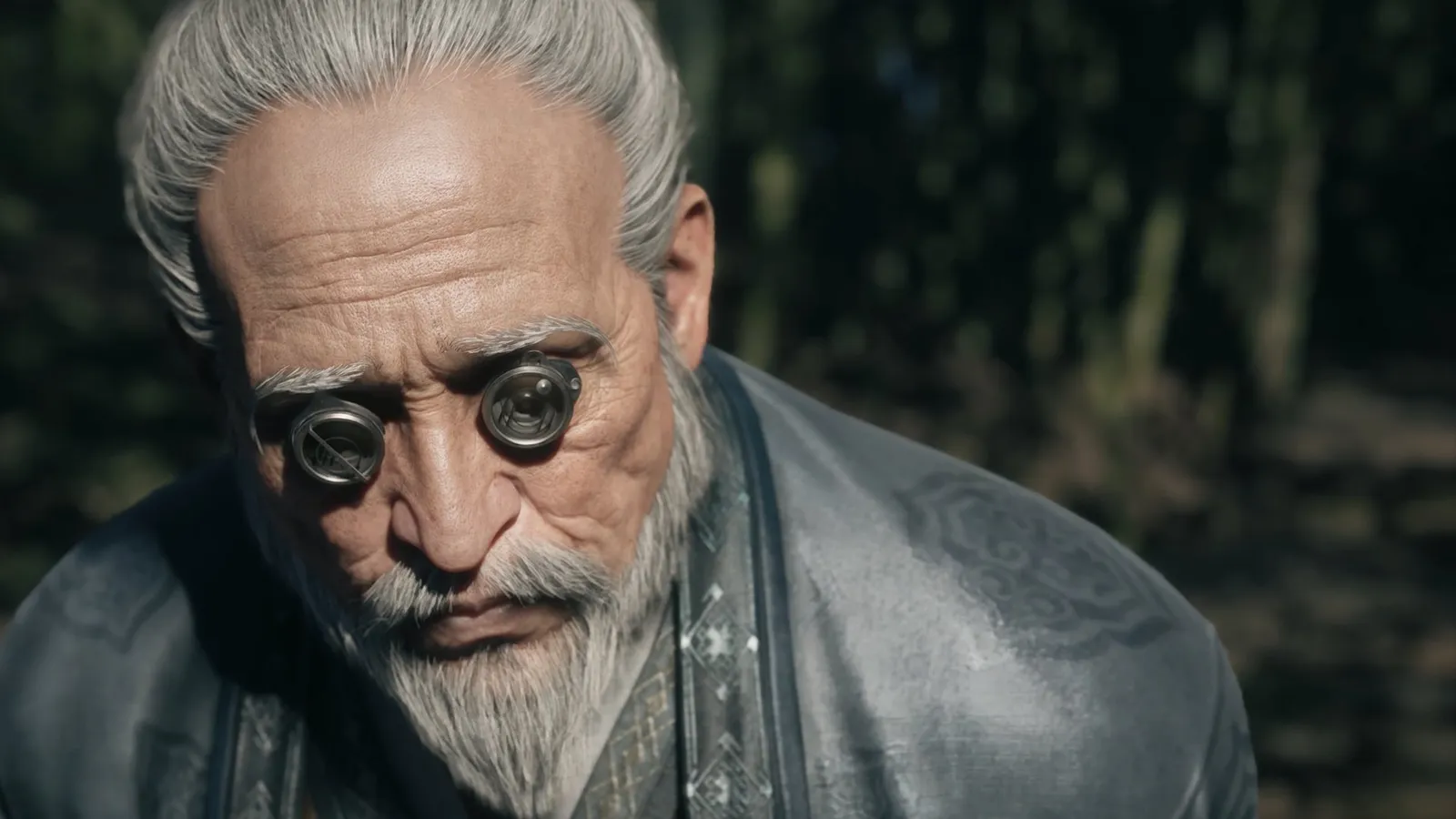 Cinematic close-up of an elderly grey-bearded man in a grey robe wearing round metal lens glasses over his eyes.