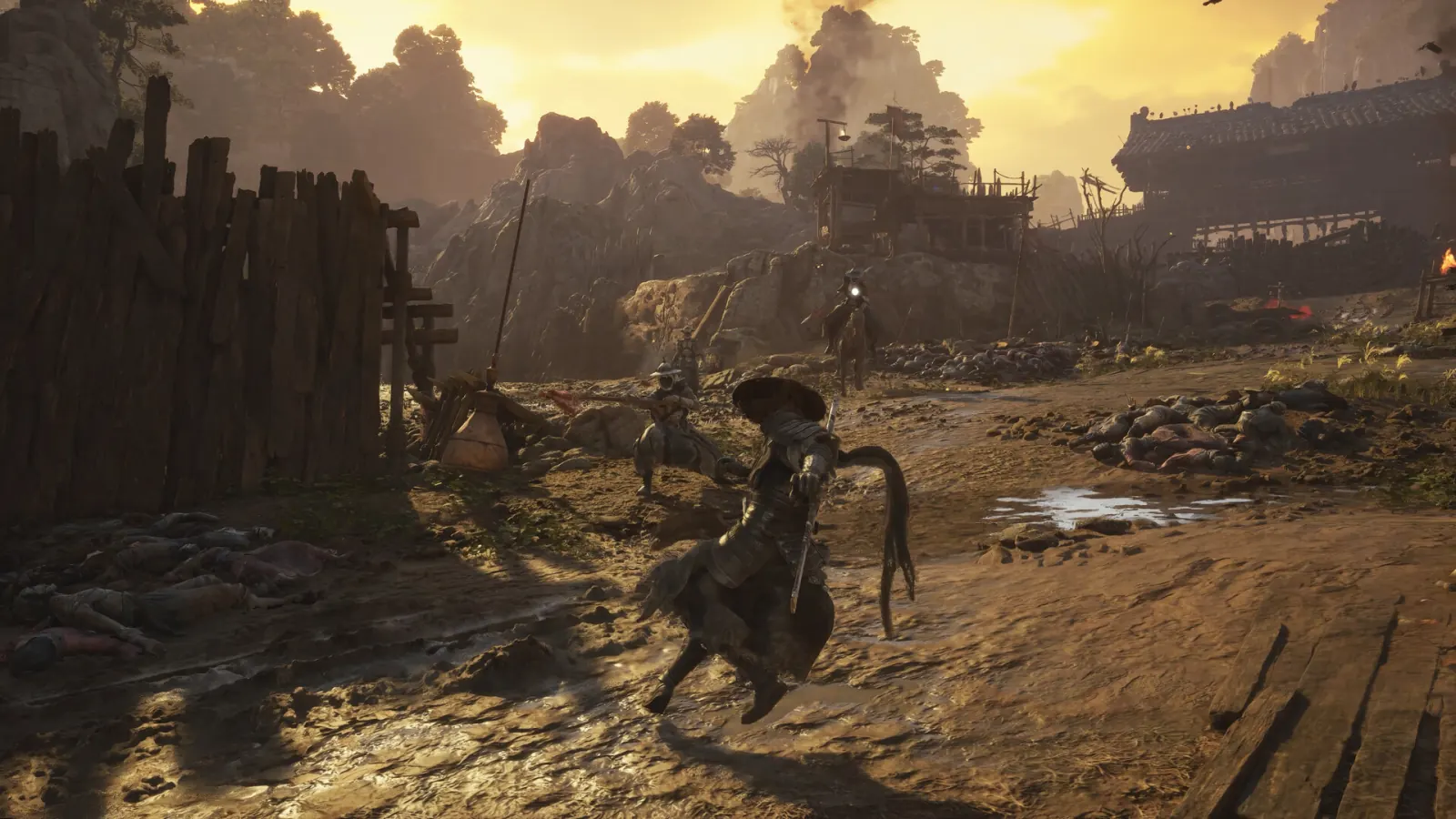 At golden sunset, the swordsman dodges a spearman on a muddy battlefield strewn with bodies; a rider approaches.